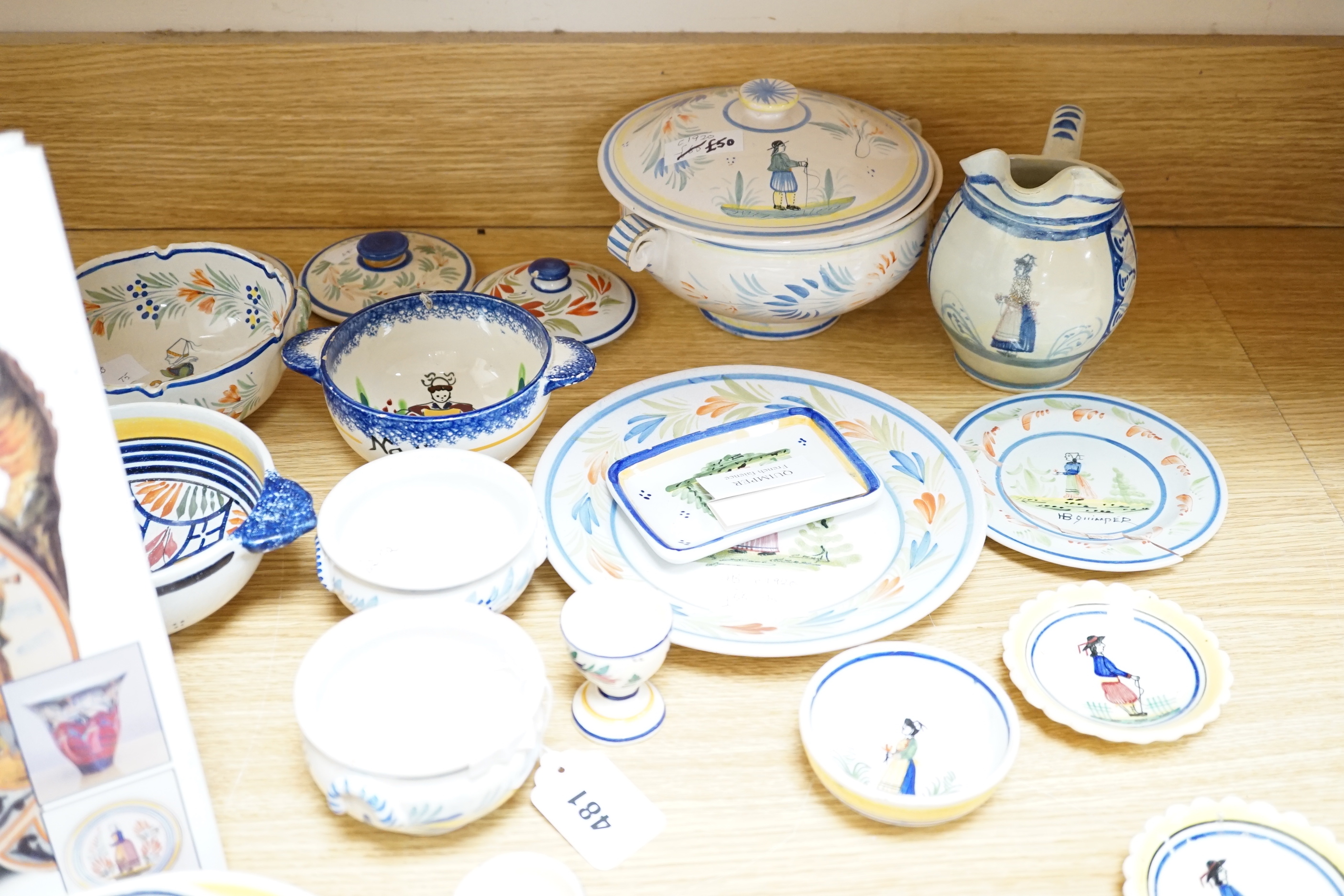A group of Quimper pottery and a Quimper Pottery book by Angela Meadows
